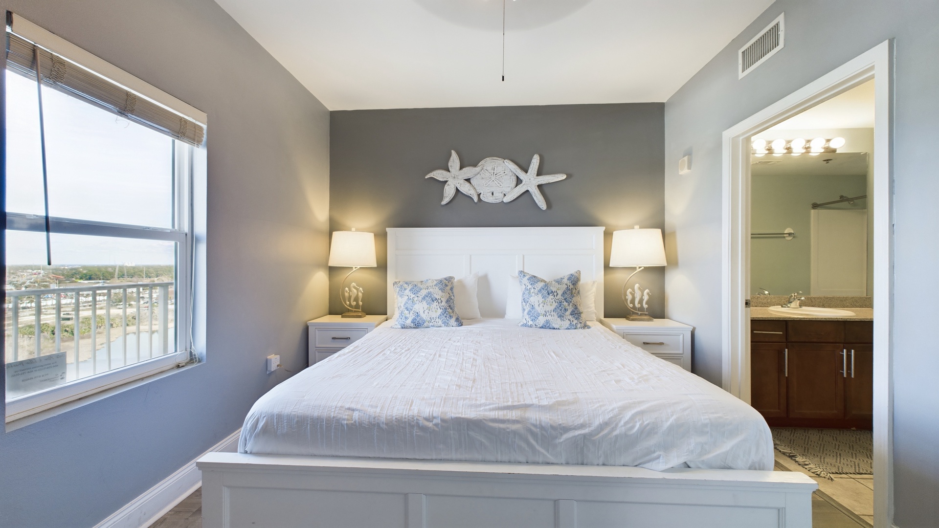 Primary bedroom with king bed and ensuite bathroom