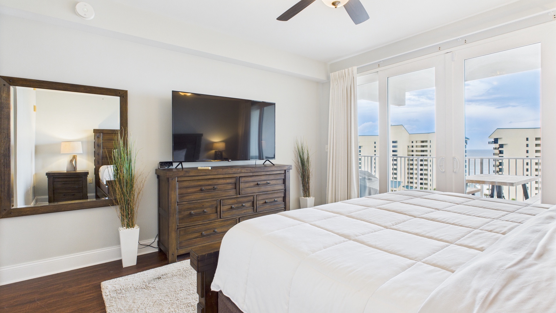 Master bedroom with king bed balcony access and ensuite bathroom (sleeps 2)