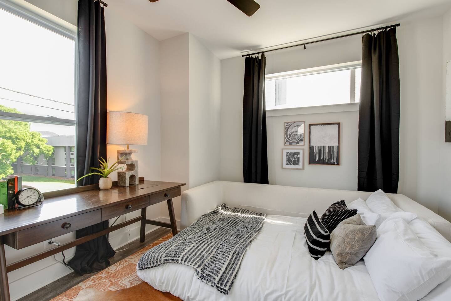 5627 - Common space with desk for work and fold out queen sleeper sofa.