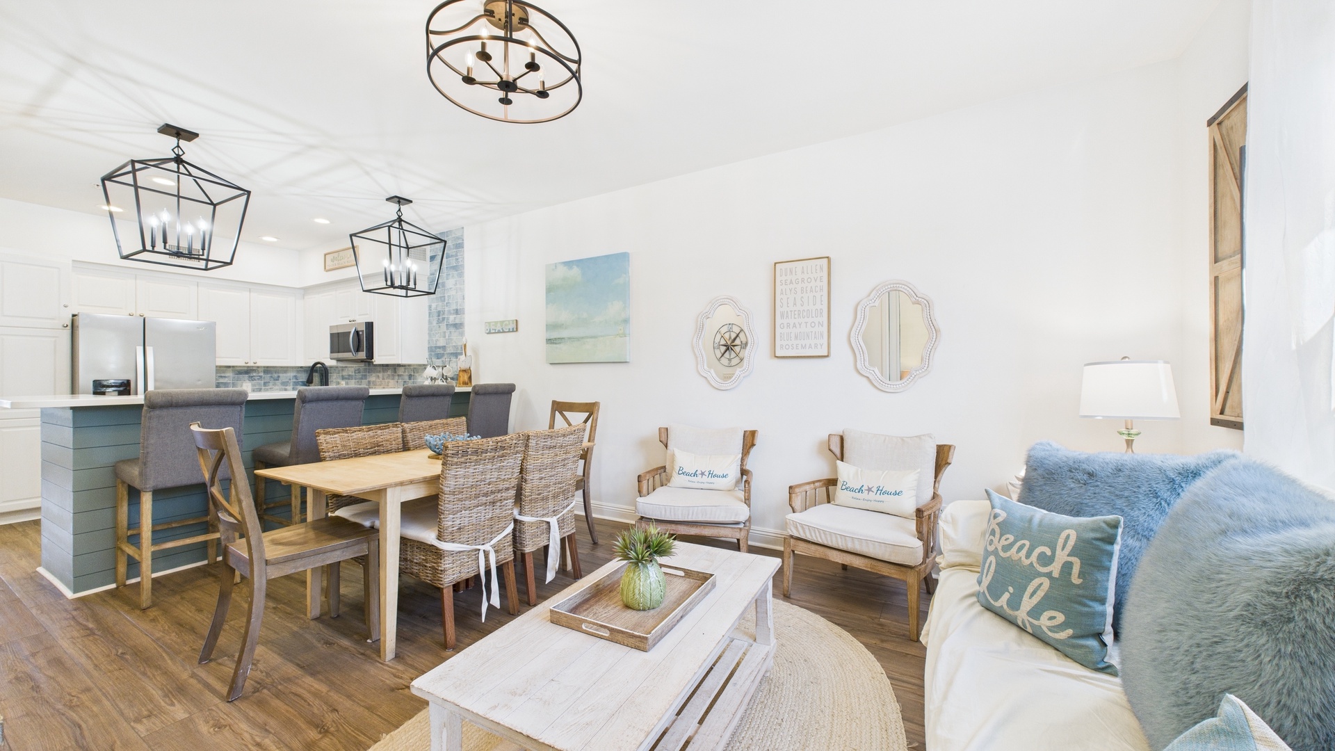 Open concept living area with TV and balcony access