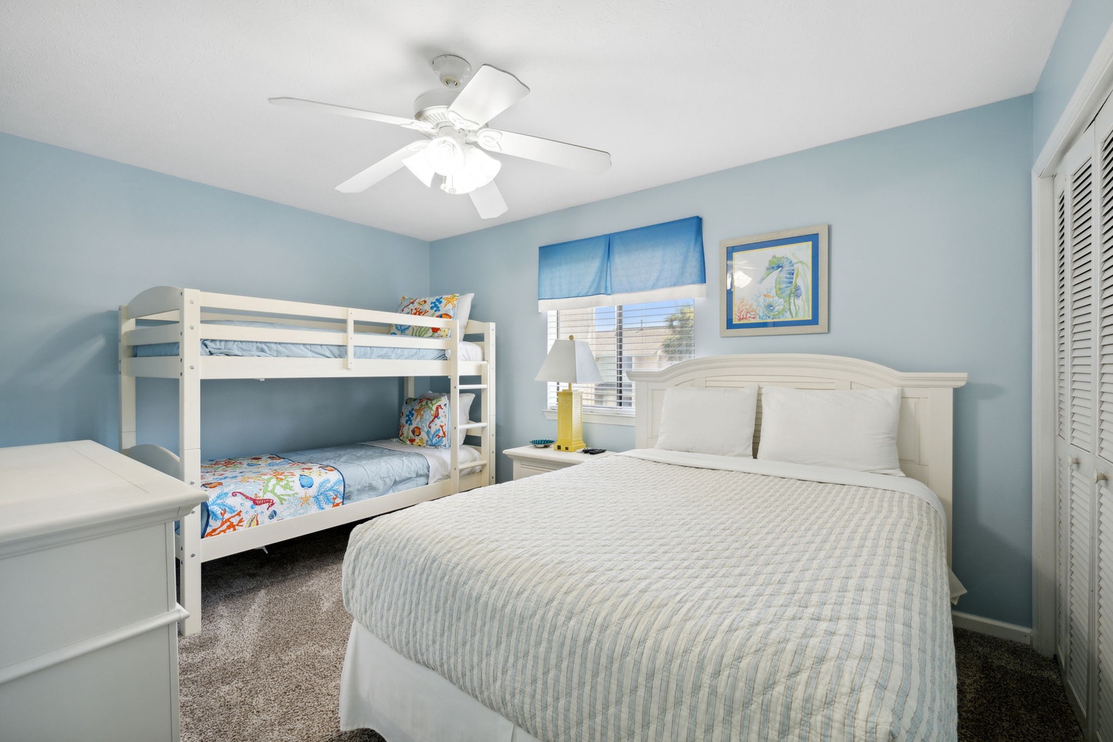 Bedroom with twin bunkbeds and double bed