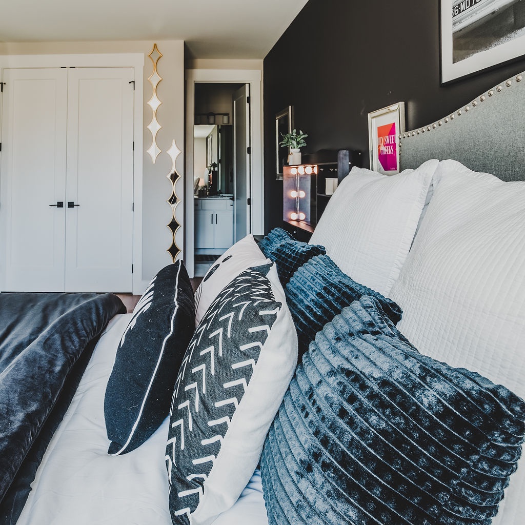 First bedroom with queen bed TV and ensuite bathroom
