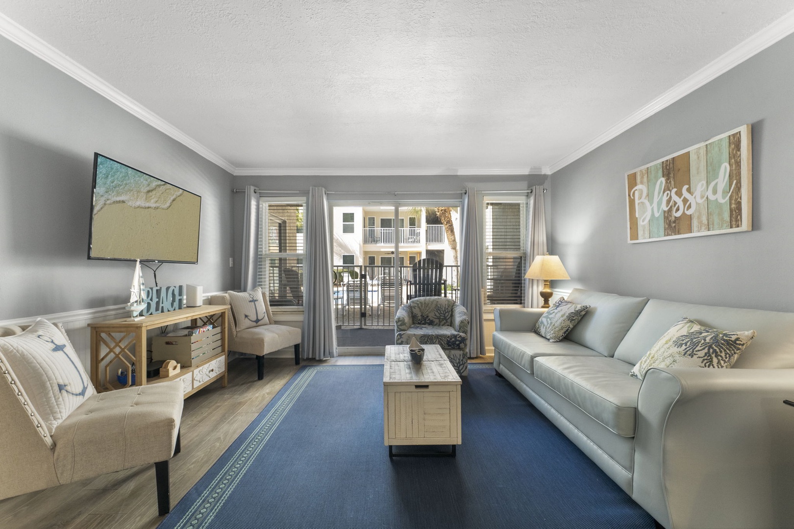 Living room with sleeper sofa & balcony access