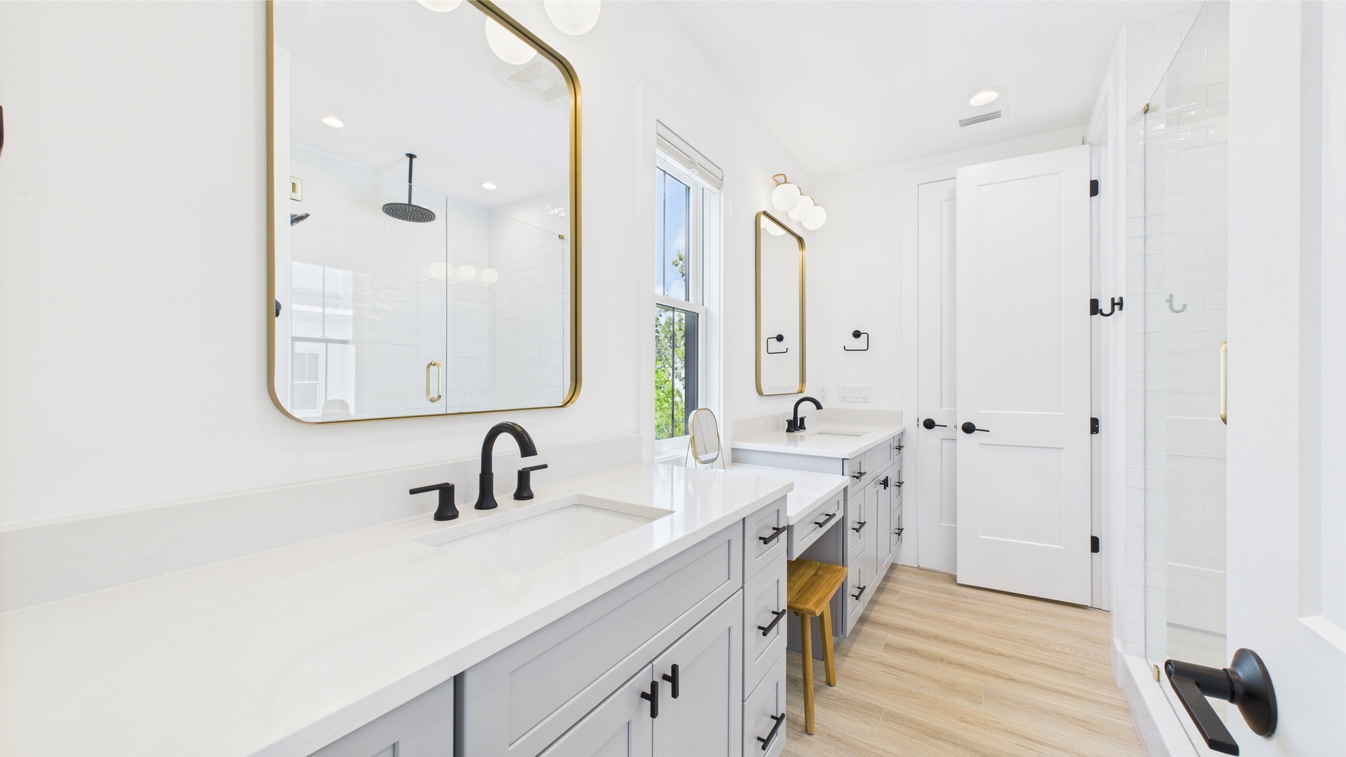 Shared ensuite bathroom with dual vanity and walk in shower
