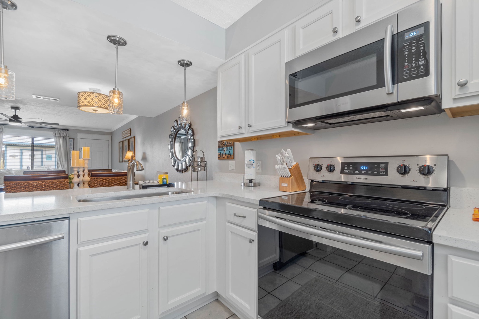 Kitchen with full amenities over looking the living room
