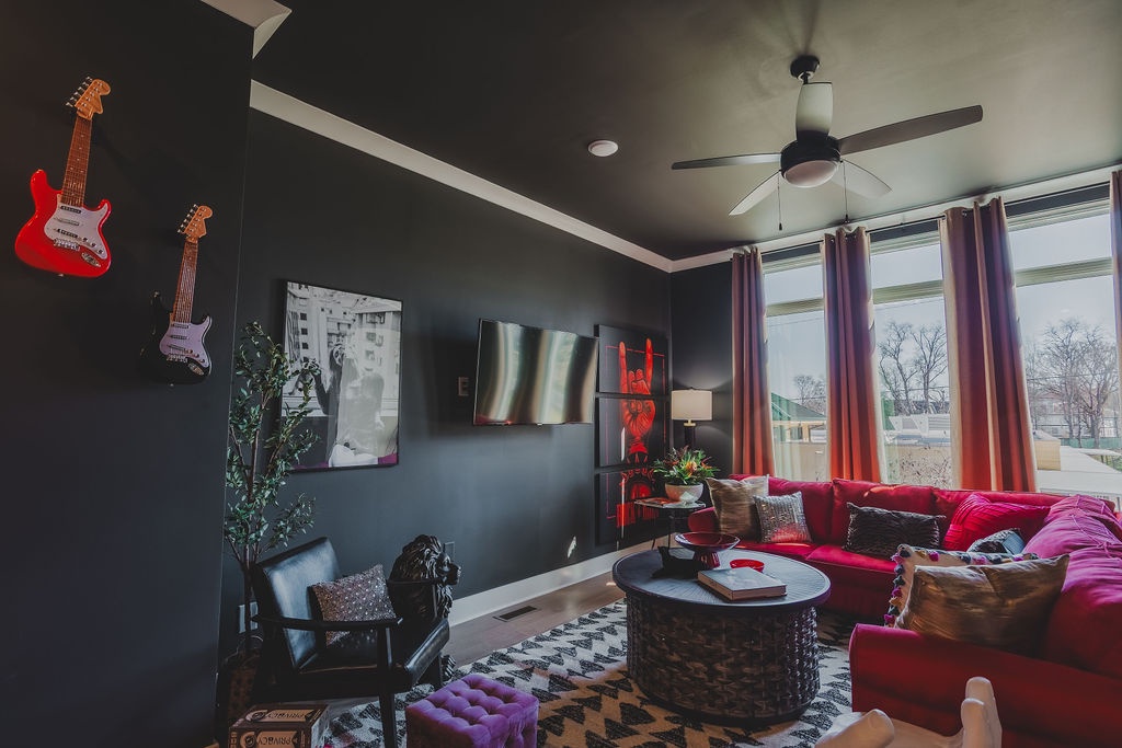 Open concept living area with stylish furnishings and TV