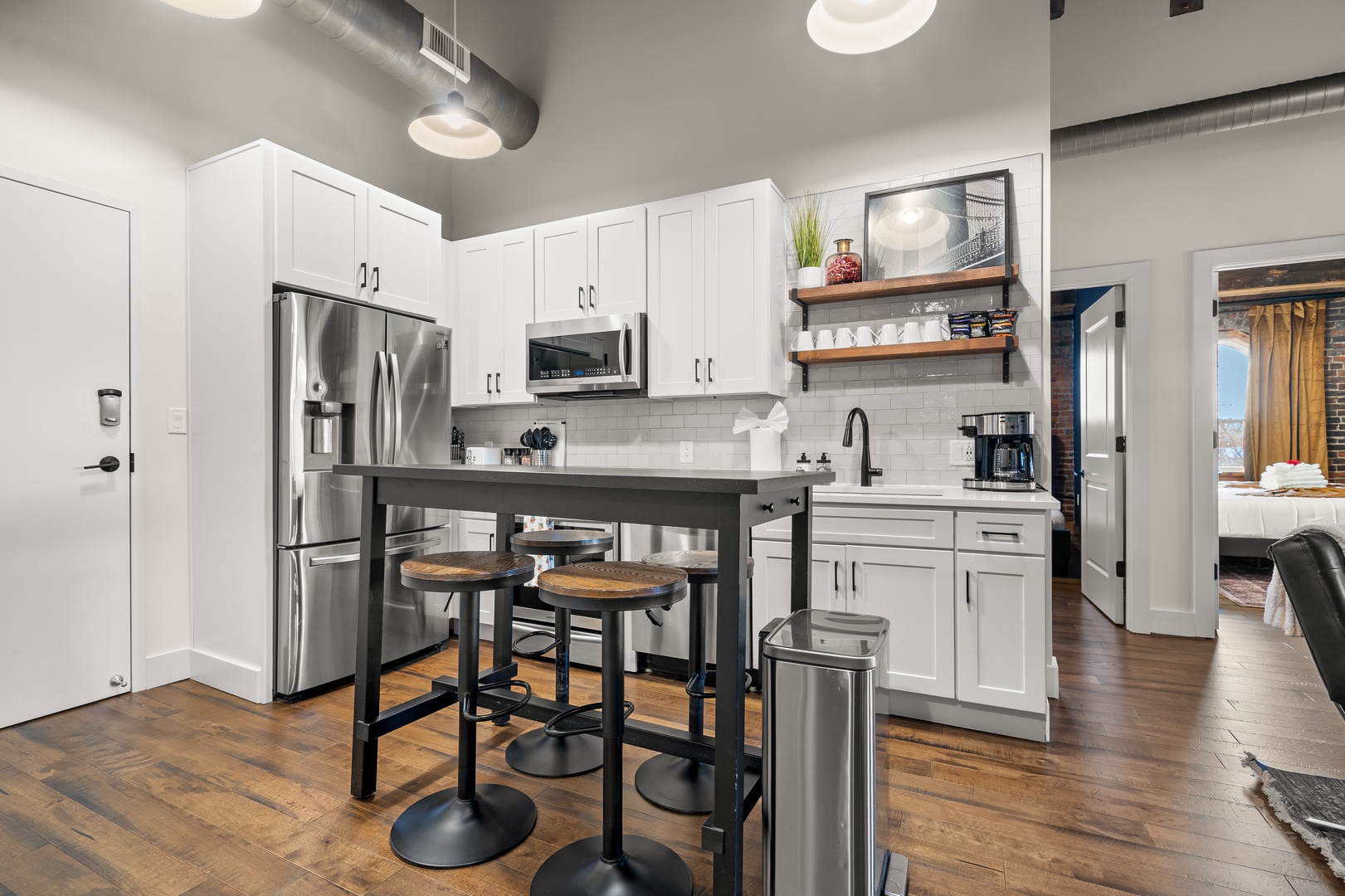 Fully equipped kitchen with bar and stainless appliances