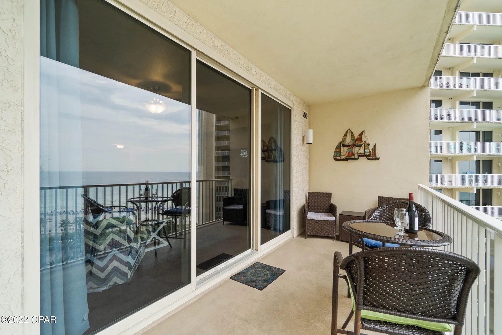 Balcony with comfortable living and dining seating.