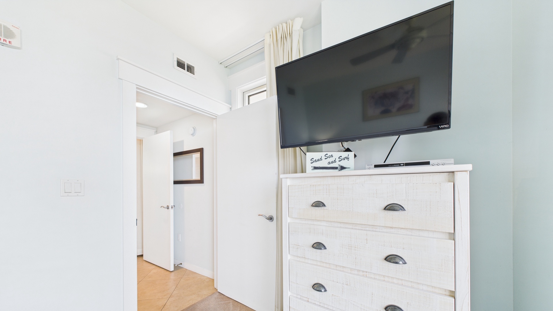 Master bedroom with king bed TV gulf views and ensuite bathroom
