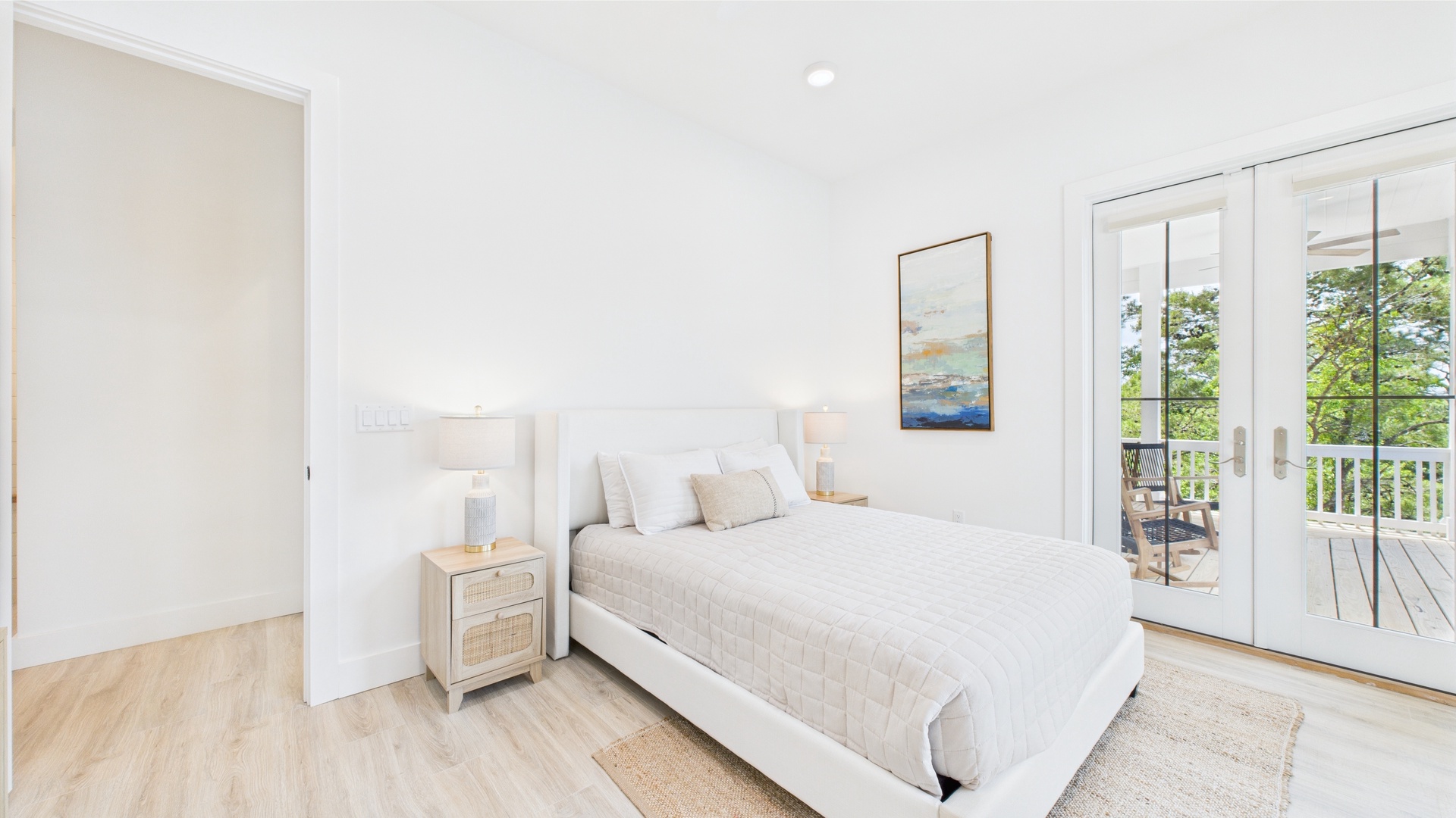 Second bedroom with queen bed TV and shared ensuite bathroom