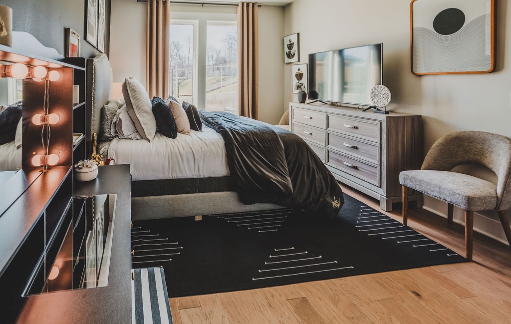 First bedroom with queen bed TV and ensuite bathroom