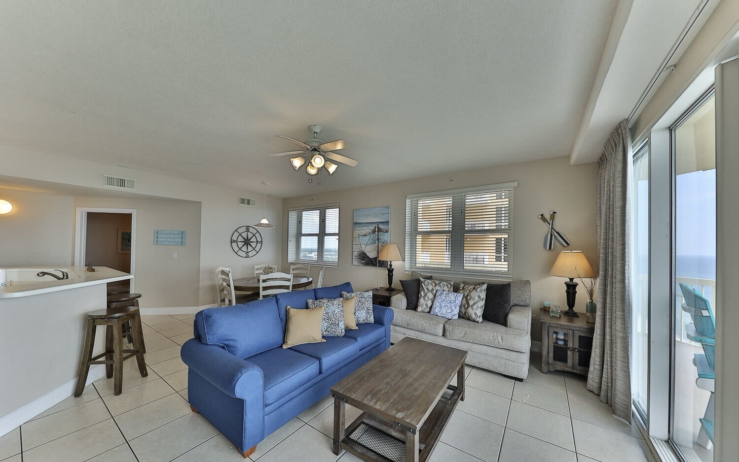 Open concept living area with sleeper sofa and gulf views