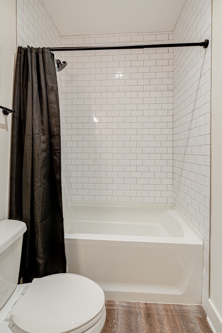 2nd Bedroom ensuite bathroom featuring a single vanity and shower/tub combo.