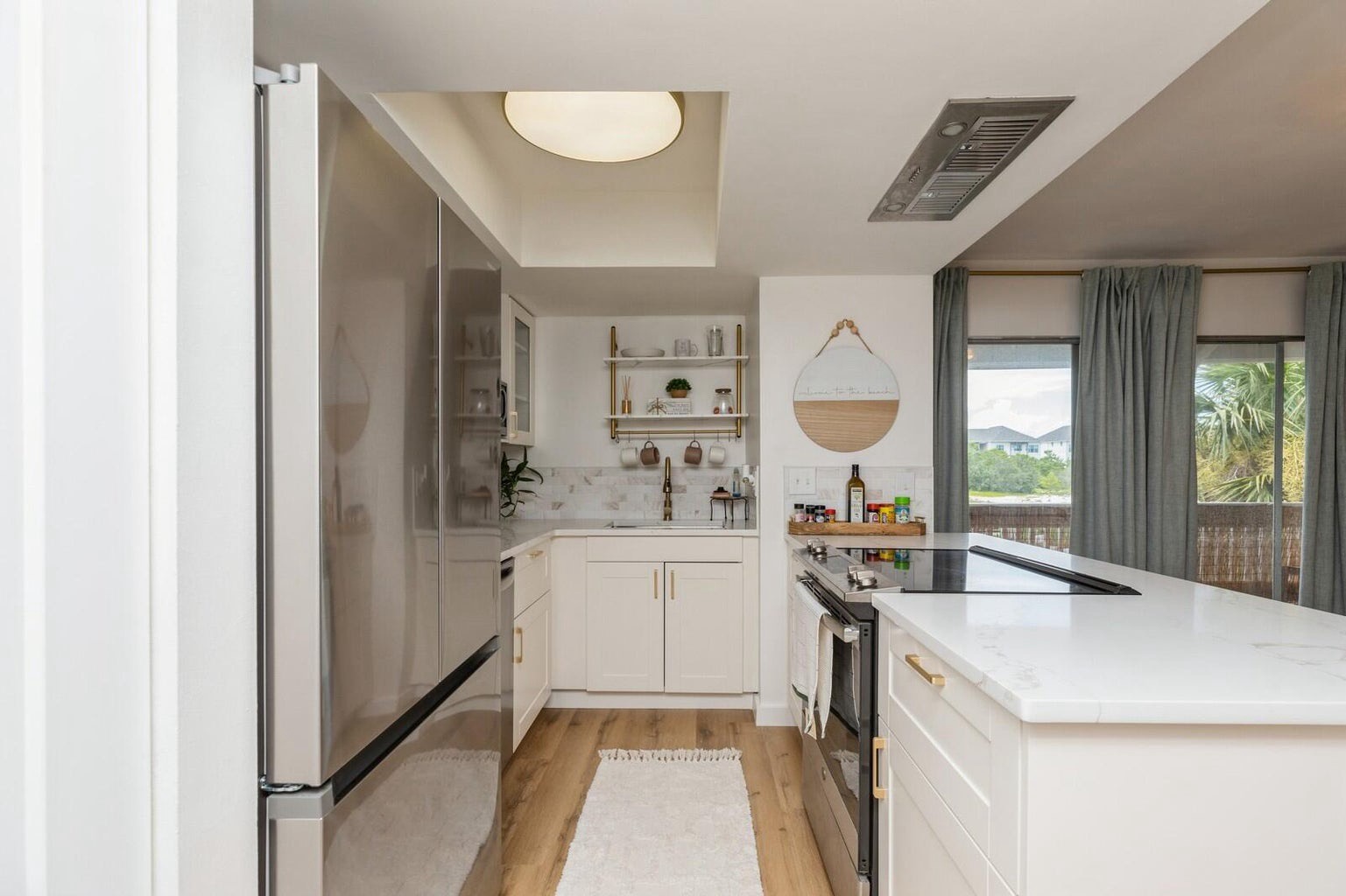 Updated stainless appliances with needed cooking supplies