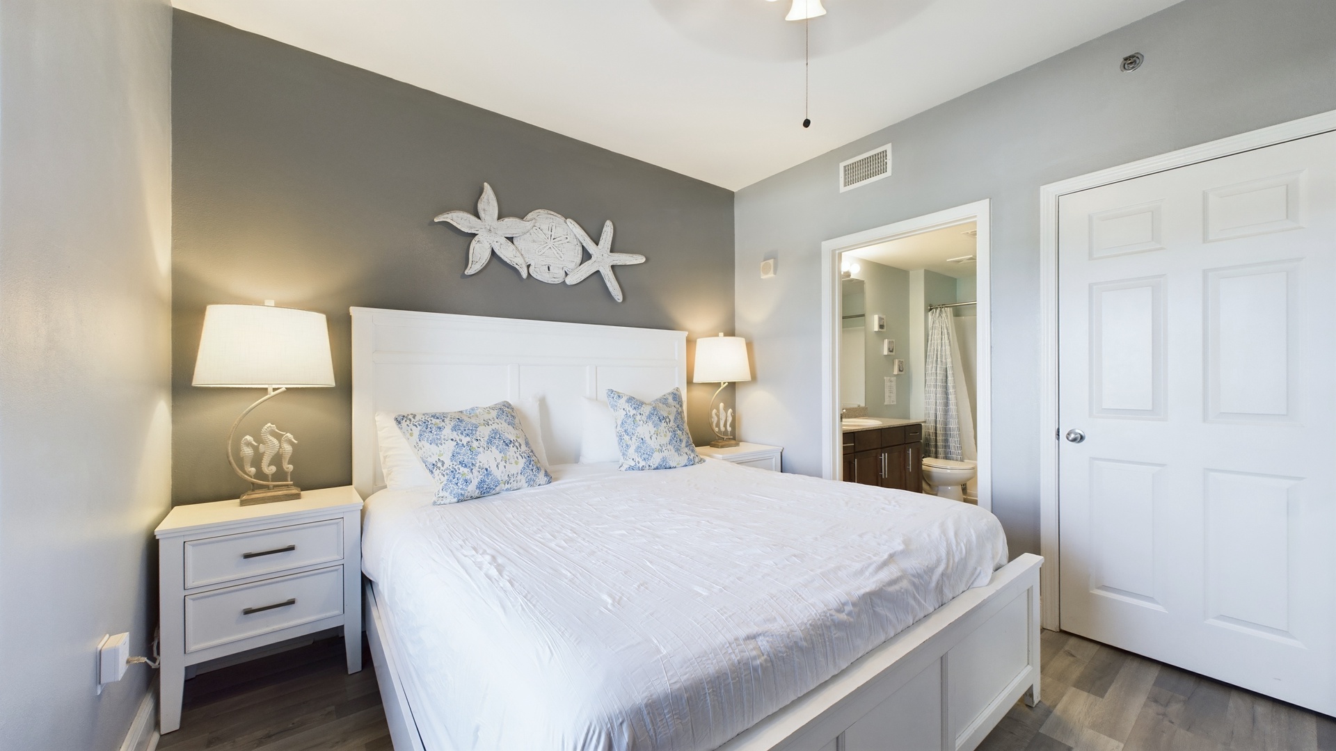 Primary bedroom with king bed and ensuite bathroom