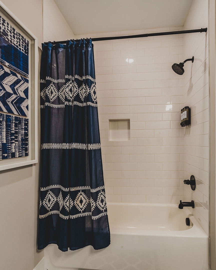 Full bathroom with shower and tub combo