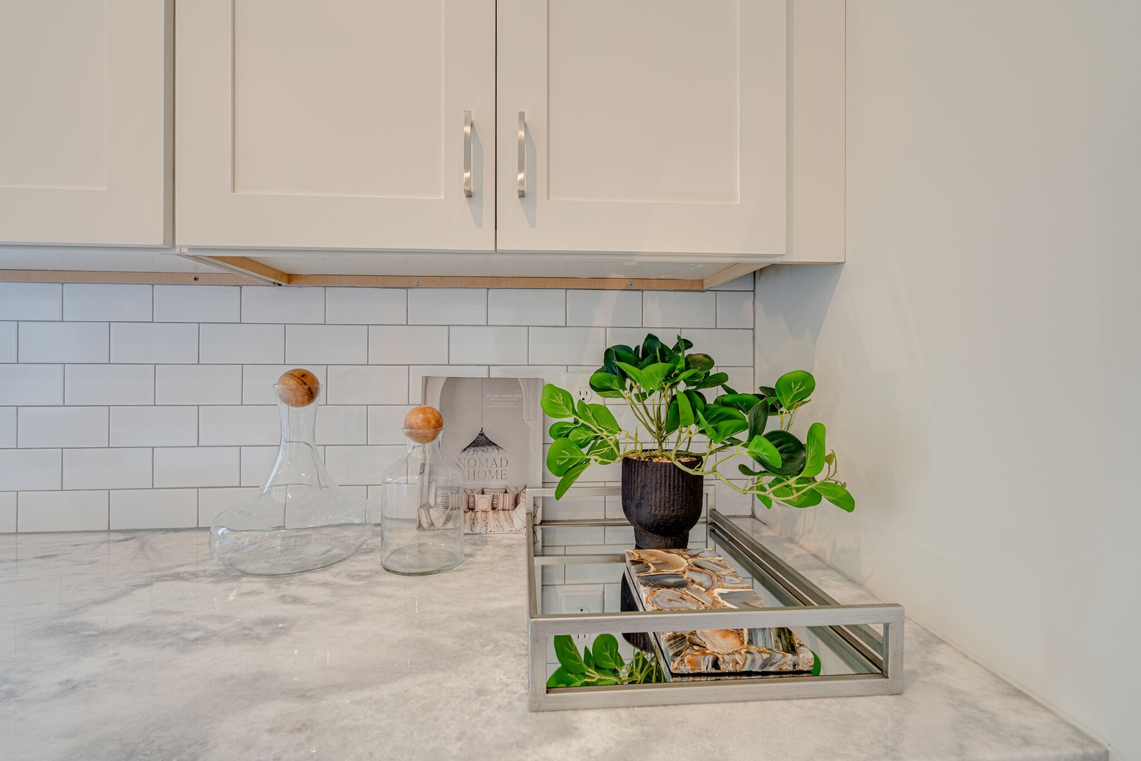 Fully equipped kitchen stocked with basic cooking essentials and stainless steel appliances.