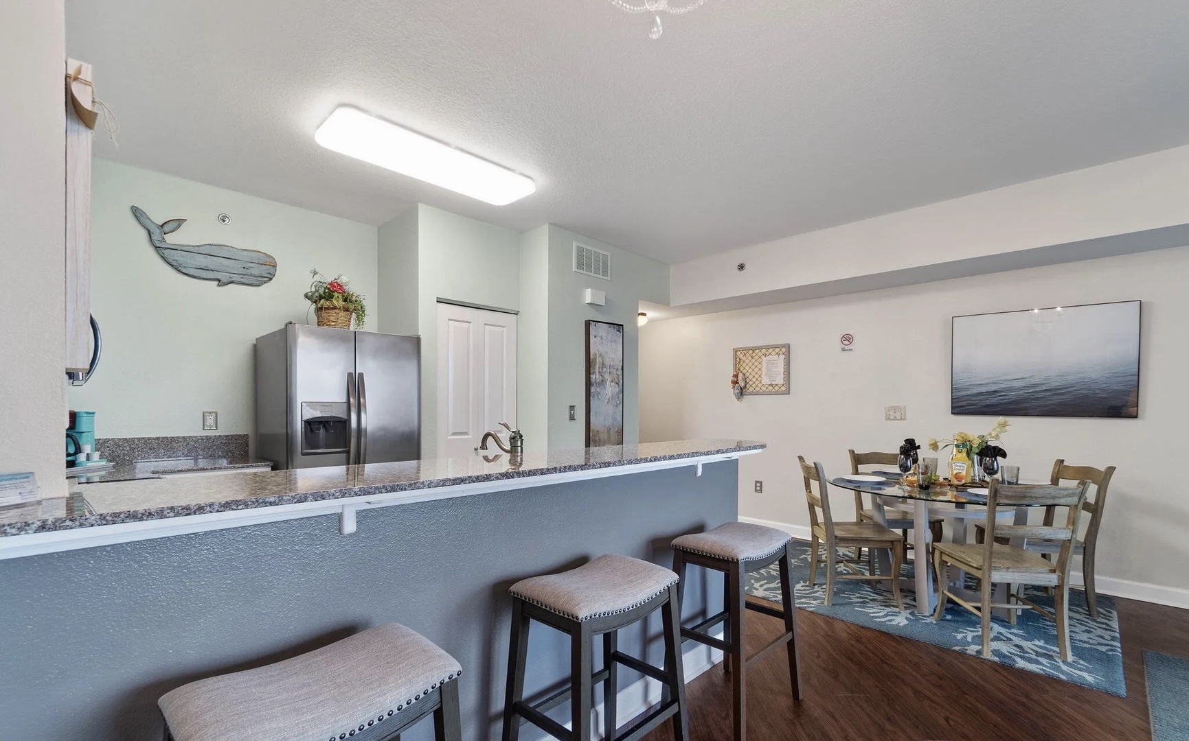Full kitchen and breakfast bar with seating for 3.