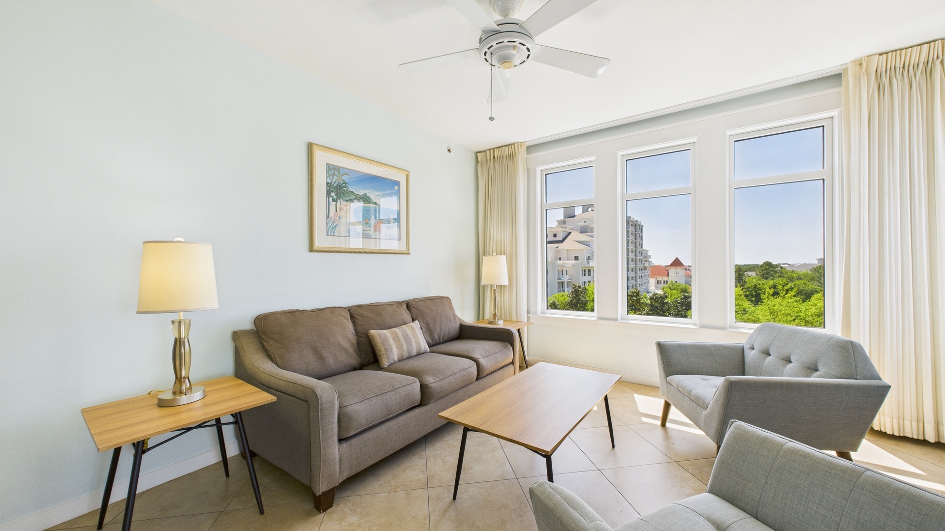 Open concept living area with stylish furnishings TV and sofa bed