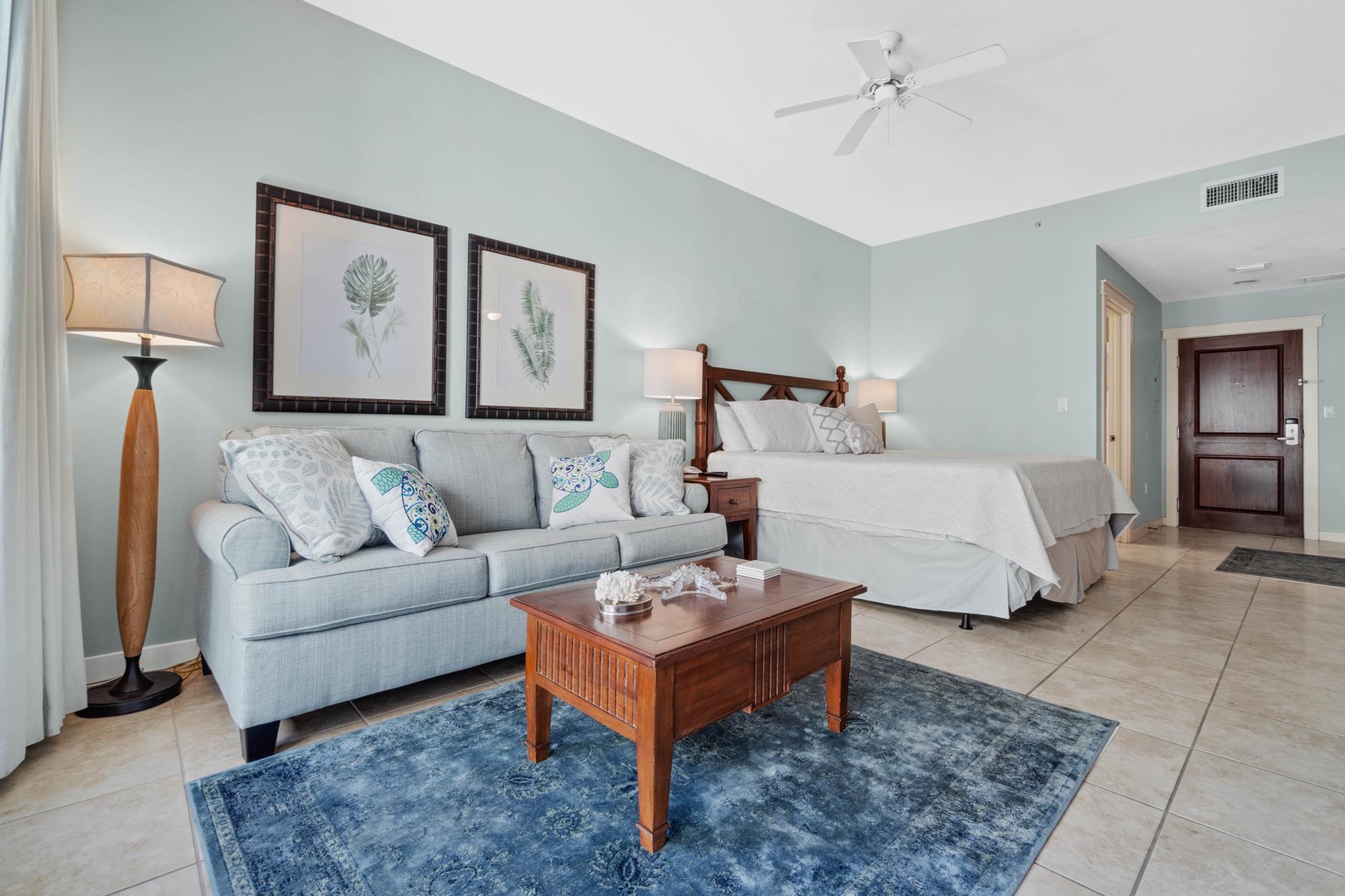 Living area with sleeper sofa and king bed