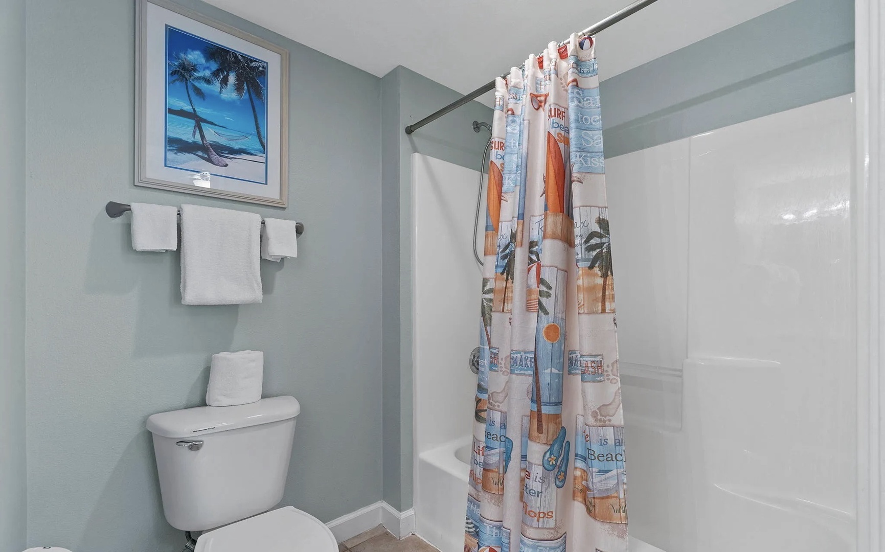 Primary bathroom with shower and tub combo.
