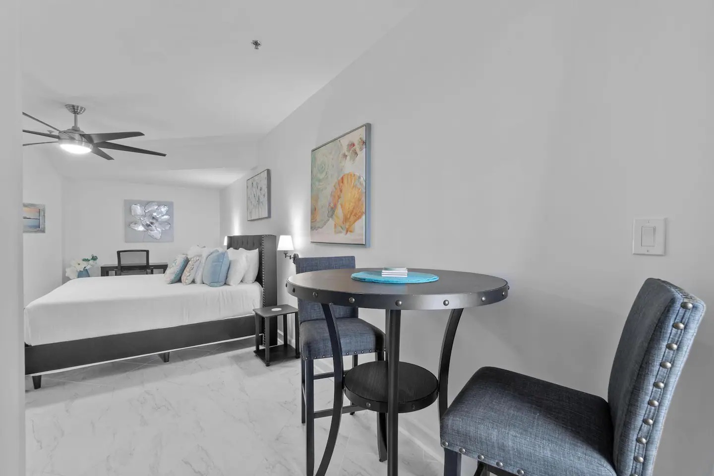 Primary bedroom with king bed desk and ensuite bathroom