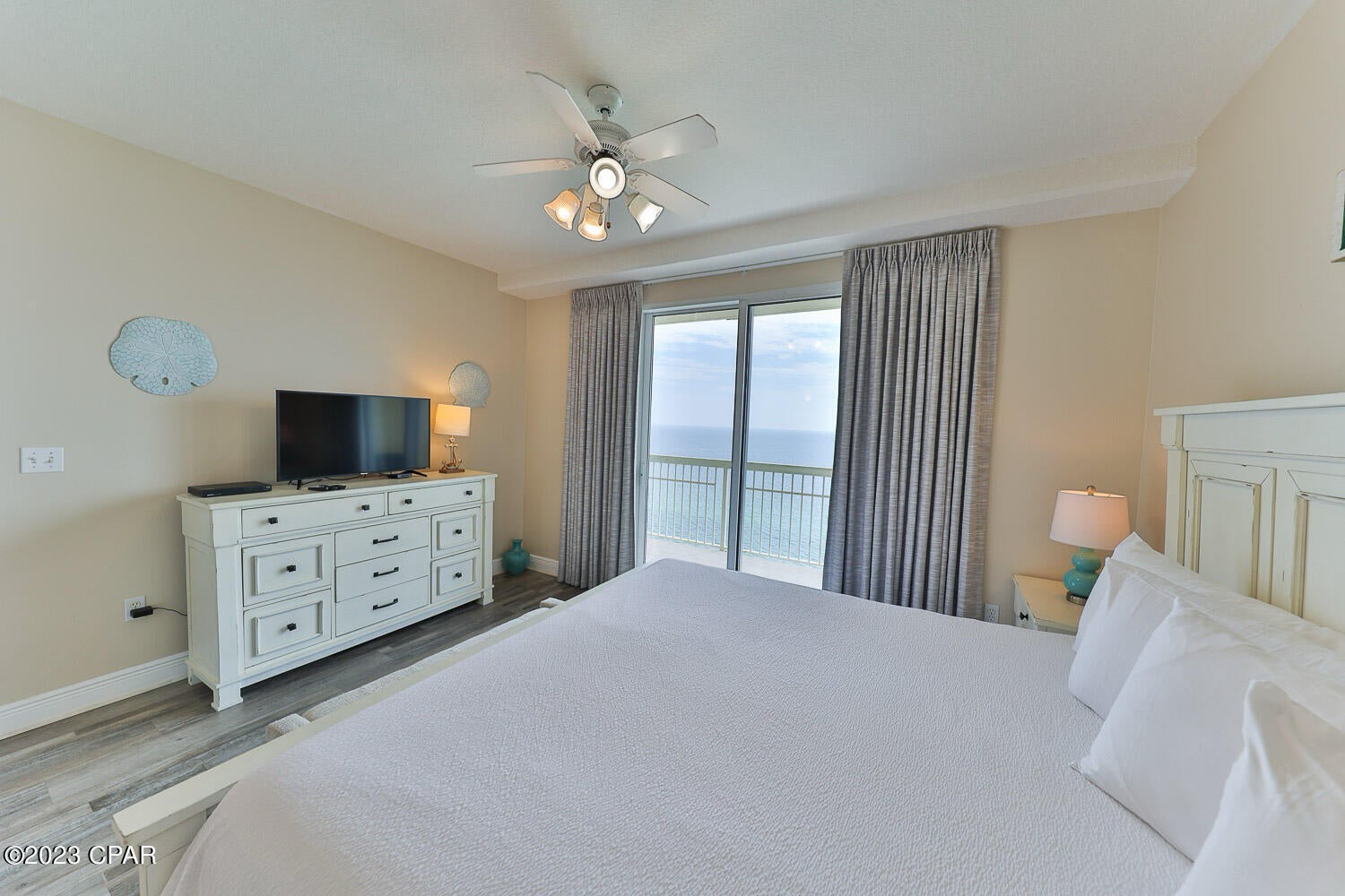 Primary bedroom with king bed and ensuite bathroom