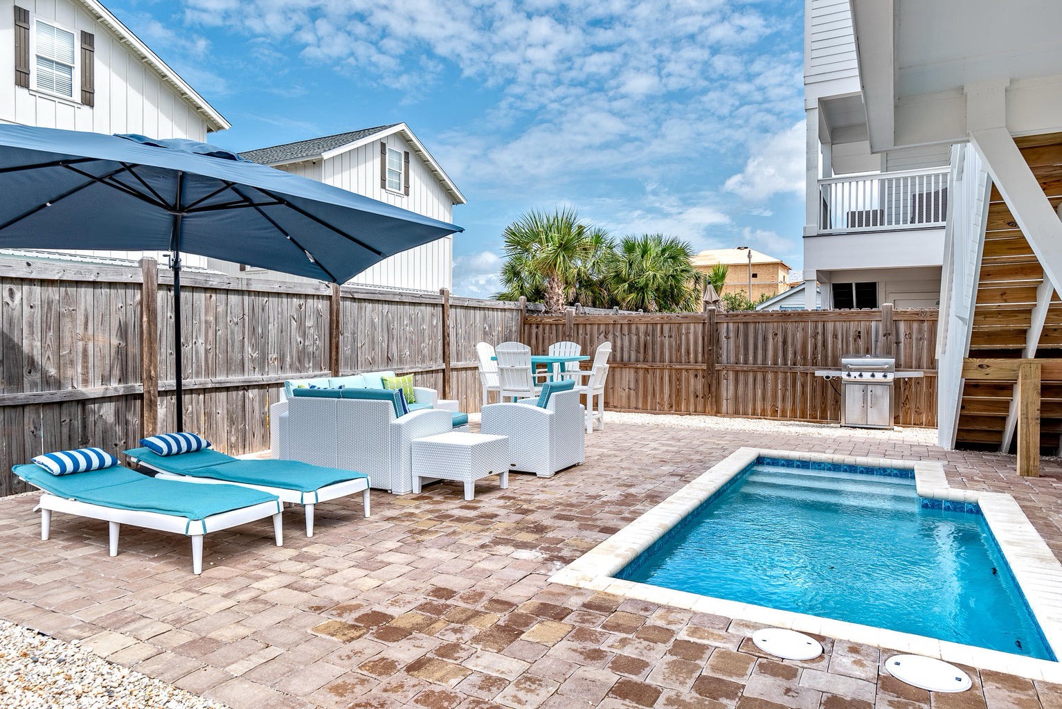 Fenced in backyard with private pool and ample seating