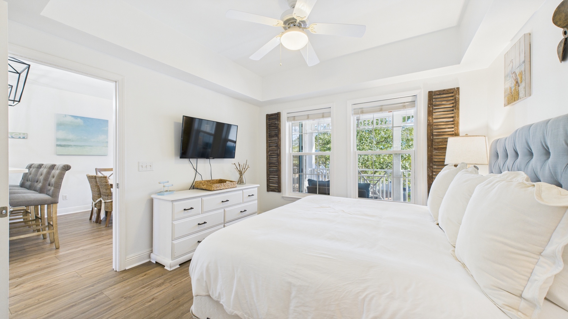 Primary bedroom with king bed TV and ensuite bathroom