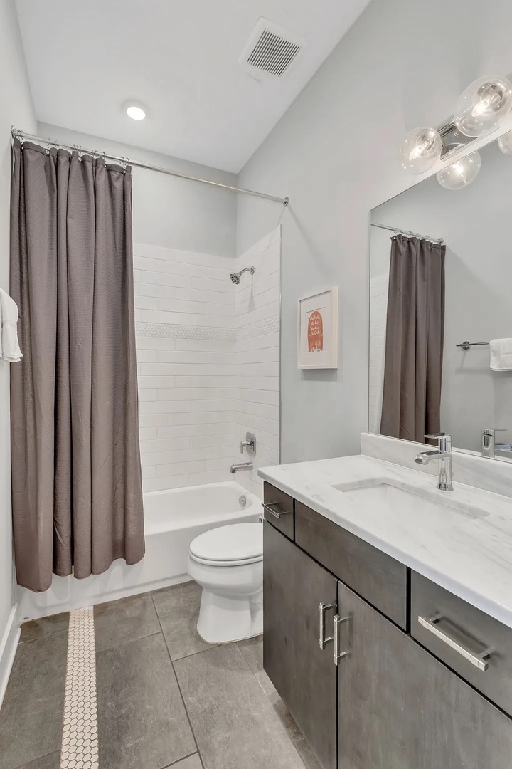 Guest bathroom with shower and tub combo