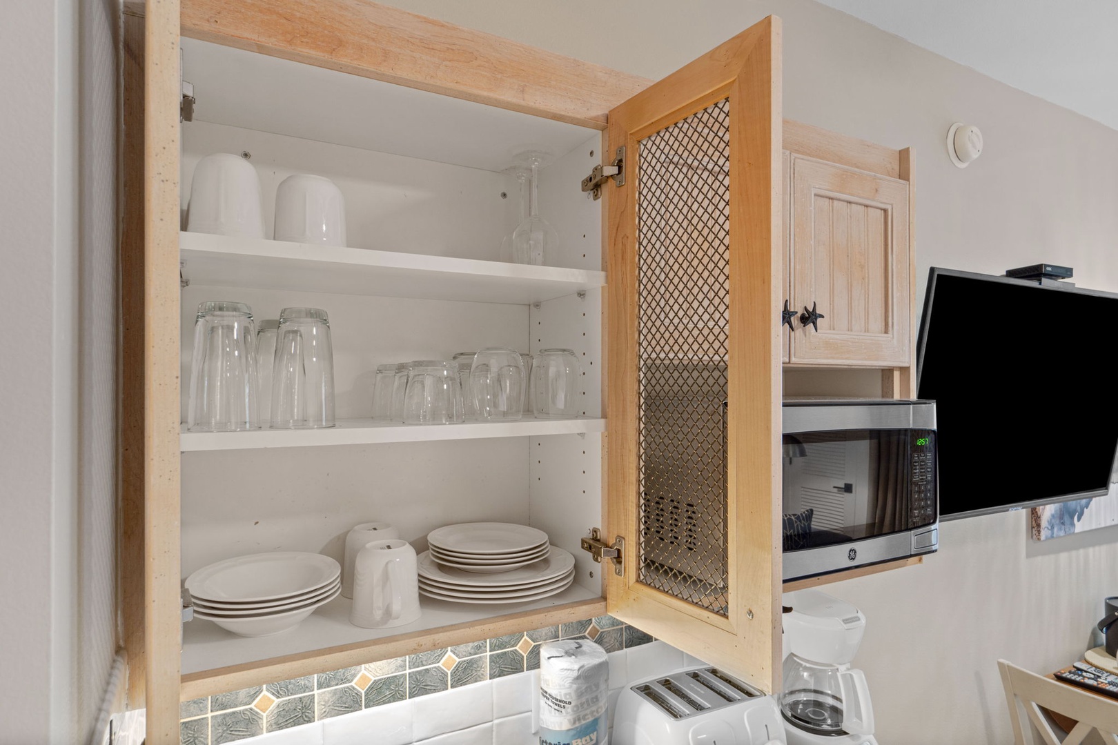 Kitchenette with plenty of cabinet space to store all of your kitchenware's.