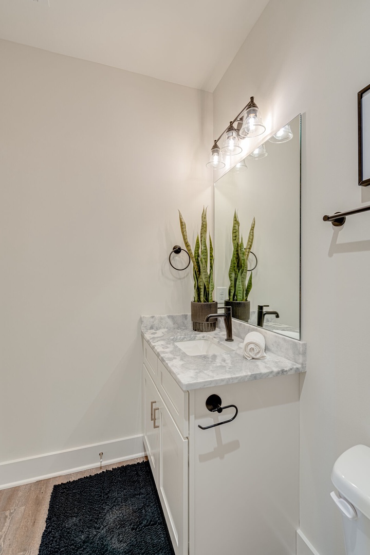 2nd Bedroom ensuite bathroom featuring a single vanity and shower/tub combo.