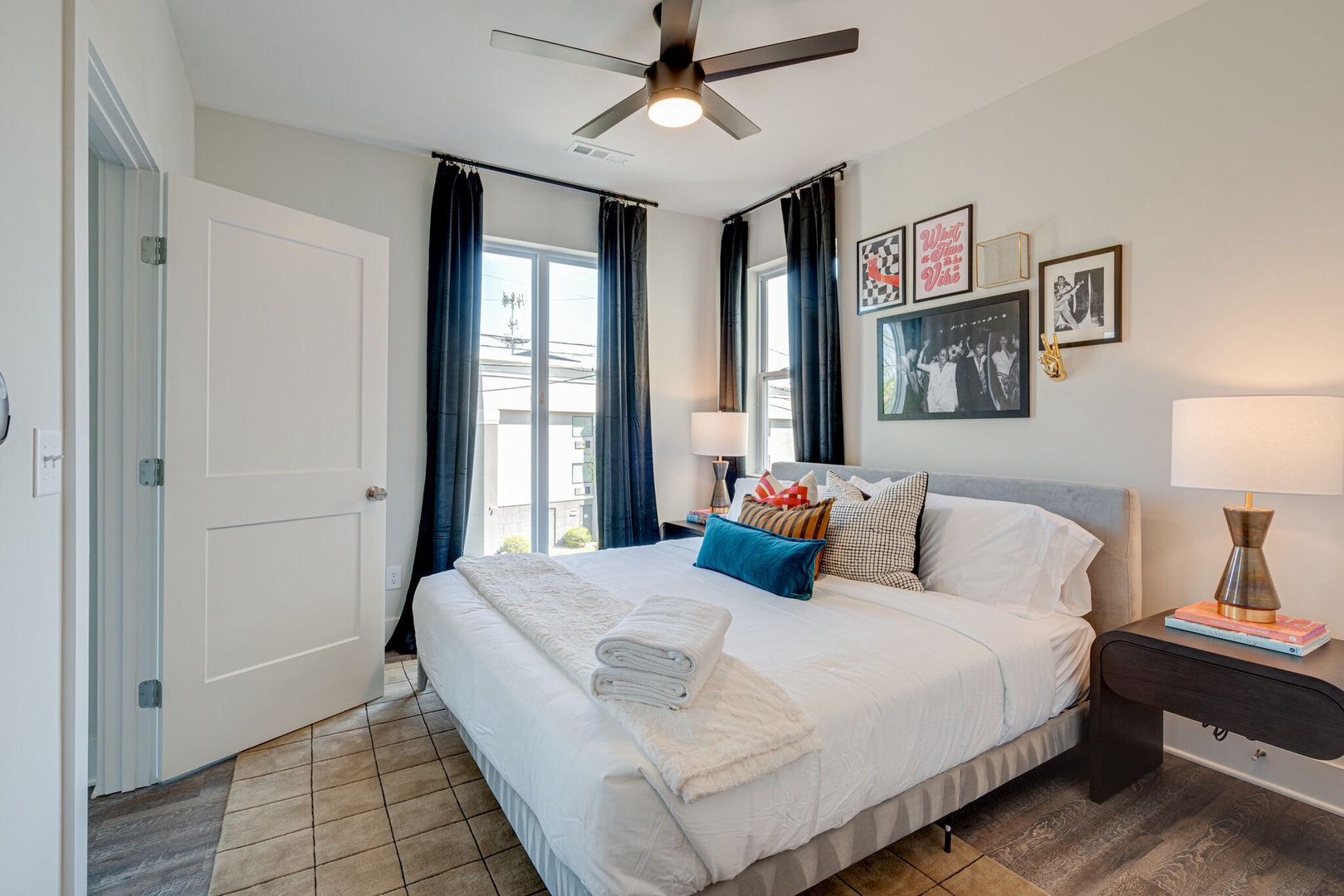 4th bedroom with King bed, designer furnishings, closet, and en-suite bathroom.