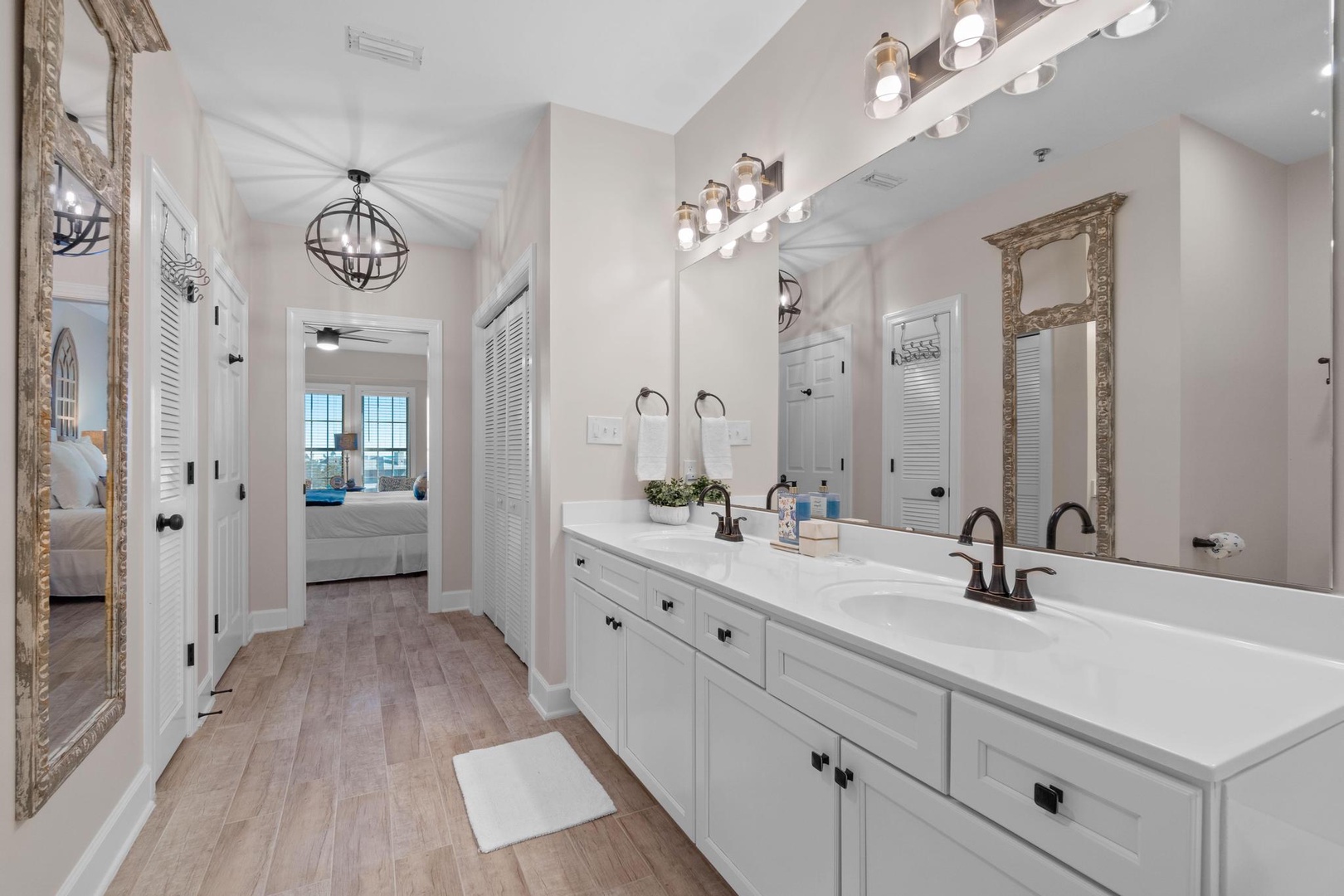 Master bathroom with custom double vanity and a large walk in shower and a jetted tub