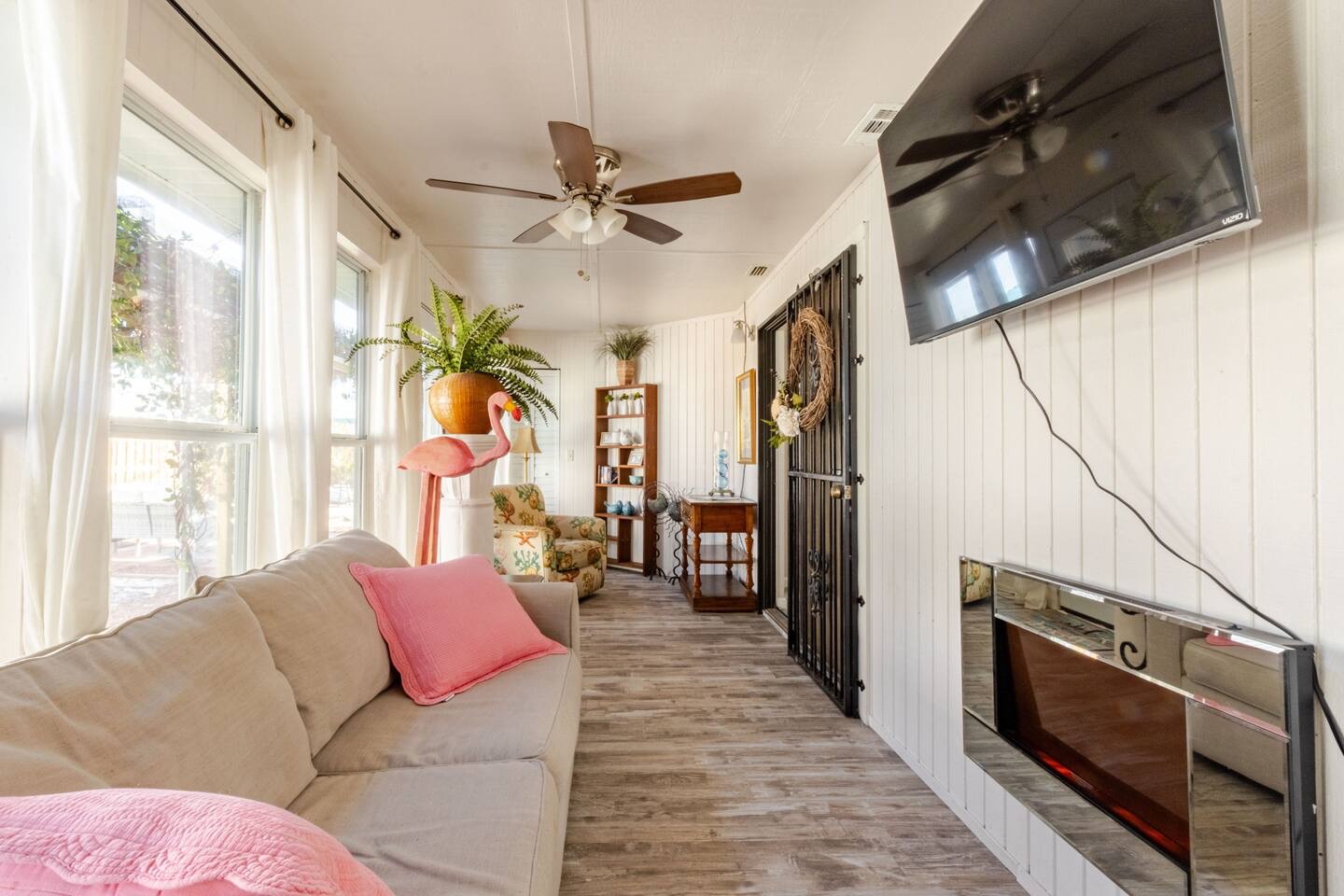 Sunroom with sleeper sofa and fireplace