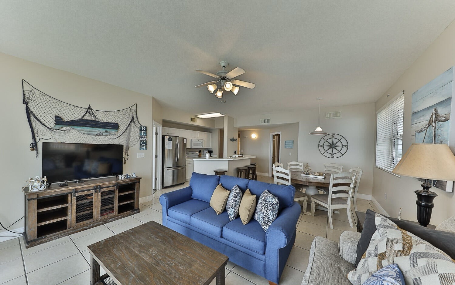 Open concept living area with sleeper sofa and gulf views