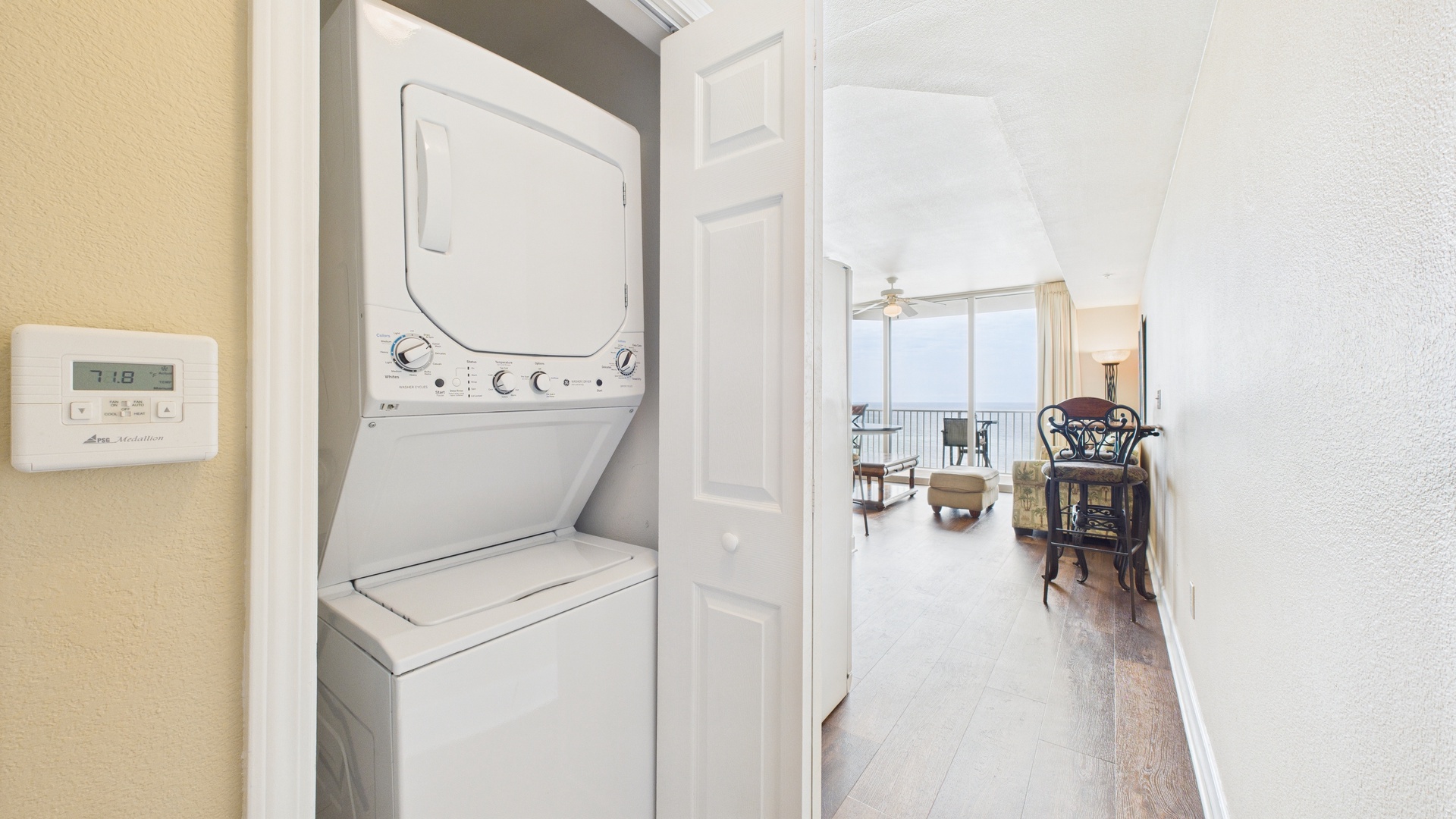 Washer and dryer machines in hallway closet