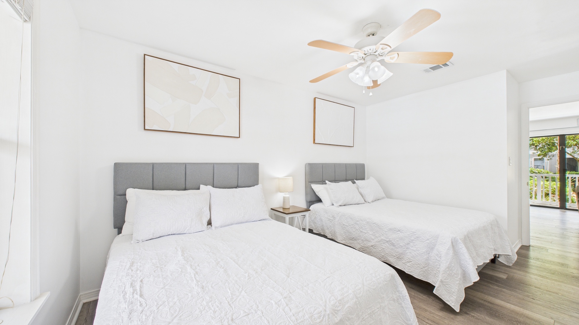 Guest bedroom with two full beds and ensuite