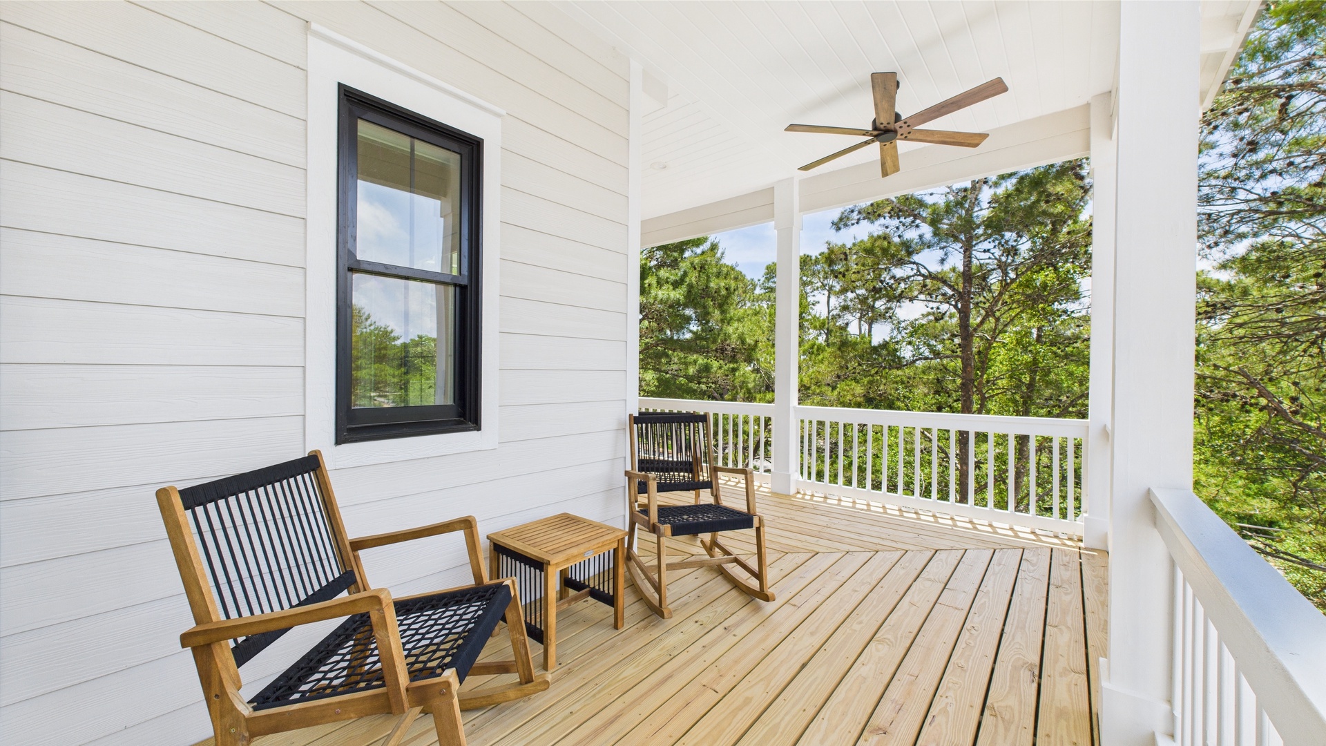 Second floor rear facing wraparound balcony with ample seating