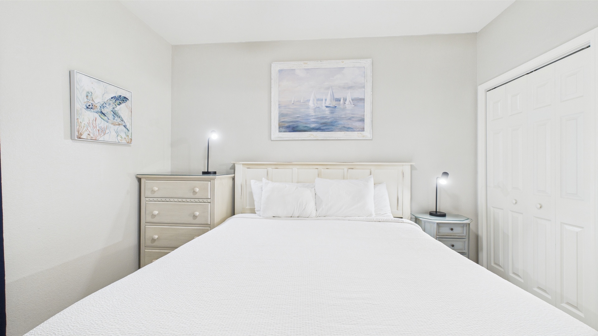 Master bedroom with king bed TV and ensuite bathroom
