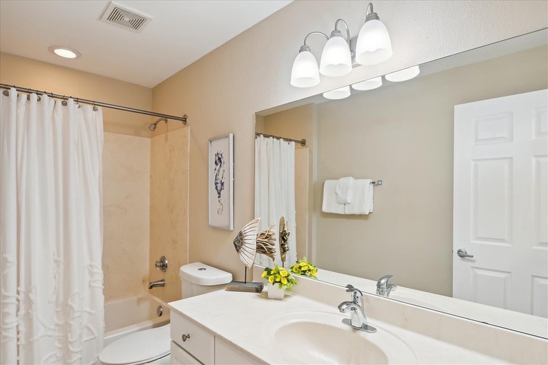 Primary bathroom with shower and tub combo