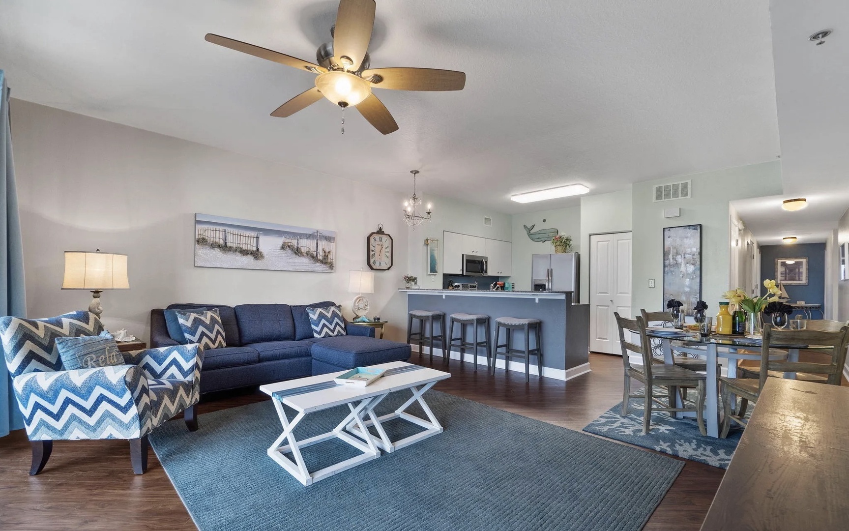 Open concept living area with stylish furnishings, TV, and scenic views. Features a queen size pullout sofa as well.