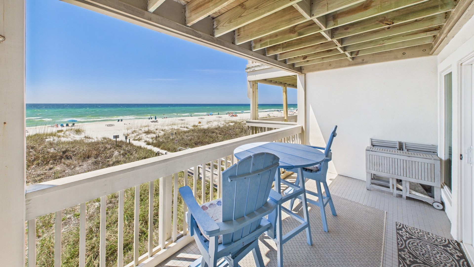 Master bedroom side of balcony with seating and table