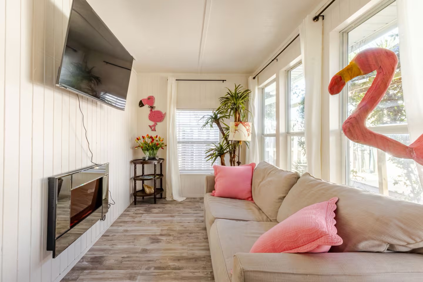Sunroom with sleeper sofa and fireplace