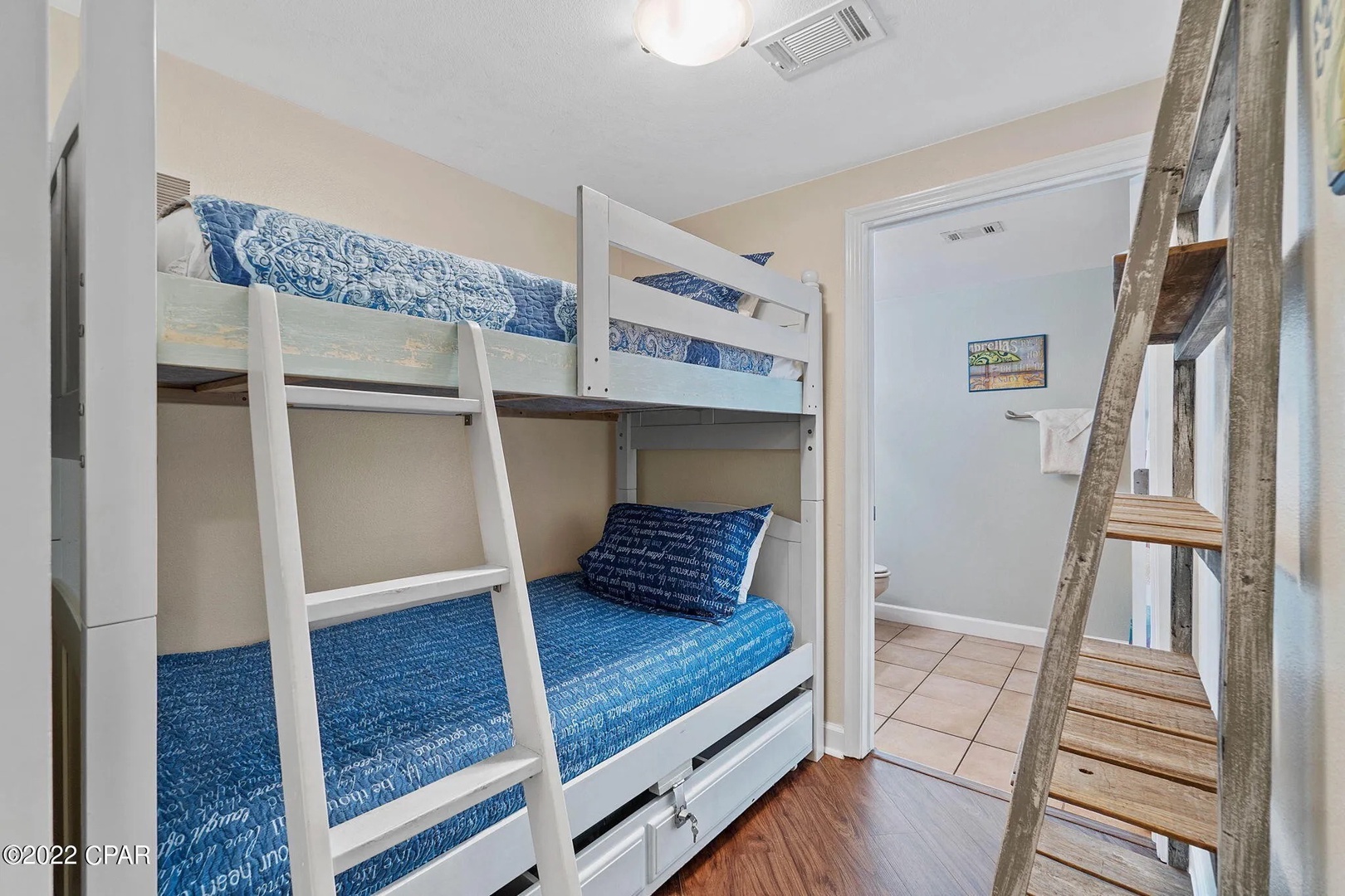 Bunk space with two twin beds and attached bathroom.