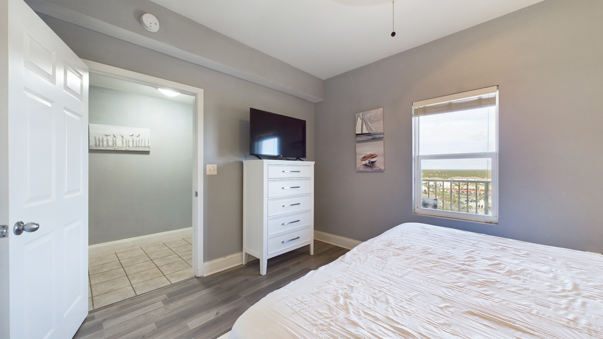 Primary bedroom with king bed and ensuite bathroom