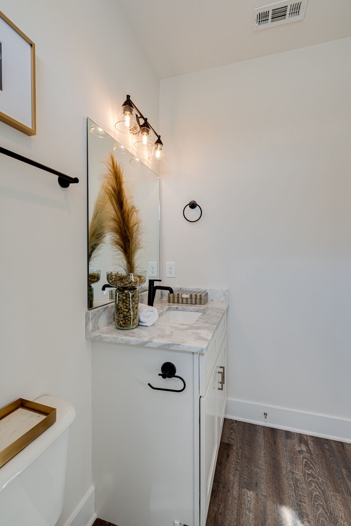 2nd bathroom that is connected to the 2nd bedroom. Features a shower and tub combo.