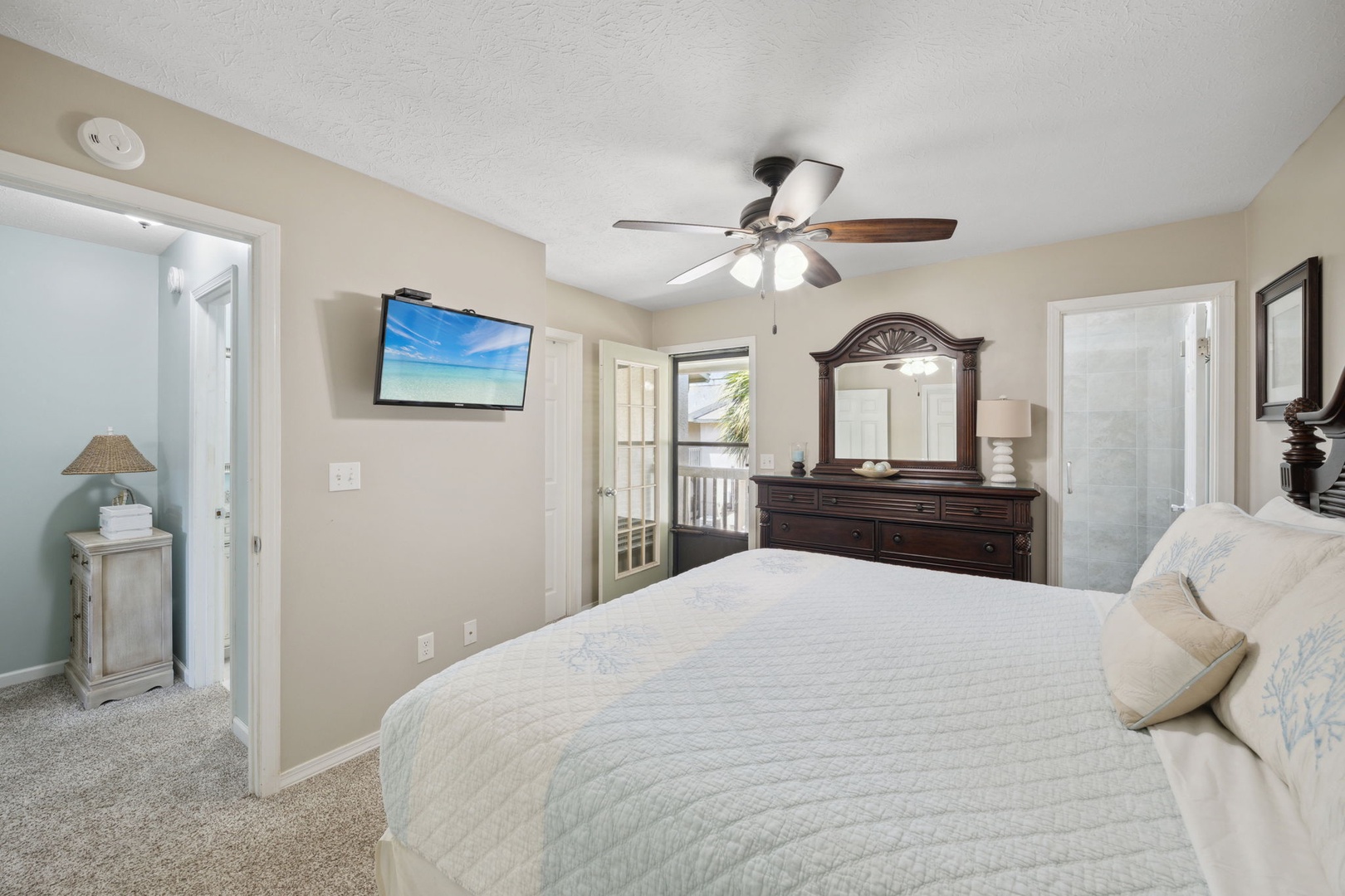 Master with king-sized bed and upper balcony access