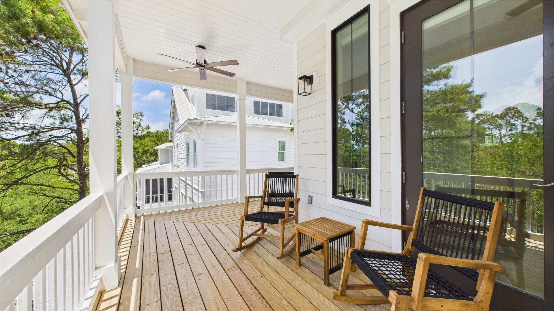 Second floor rear facing wraparound balcony with ample seating