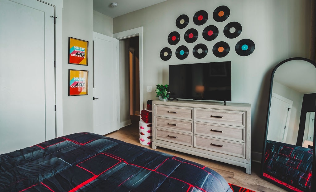 Second bedroom with queen bed and TV